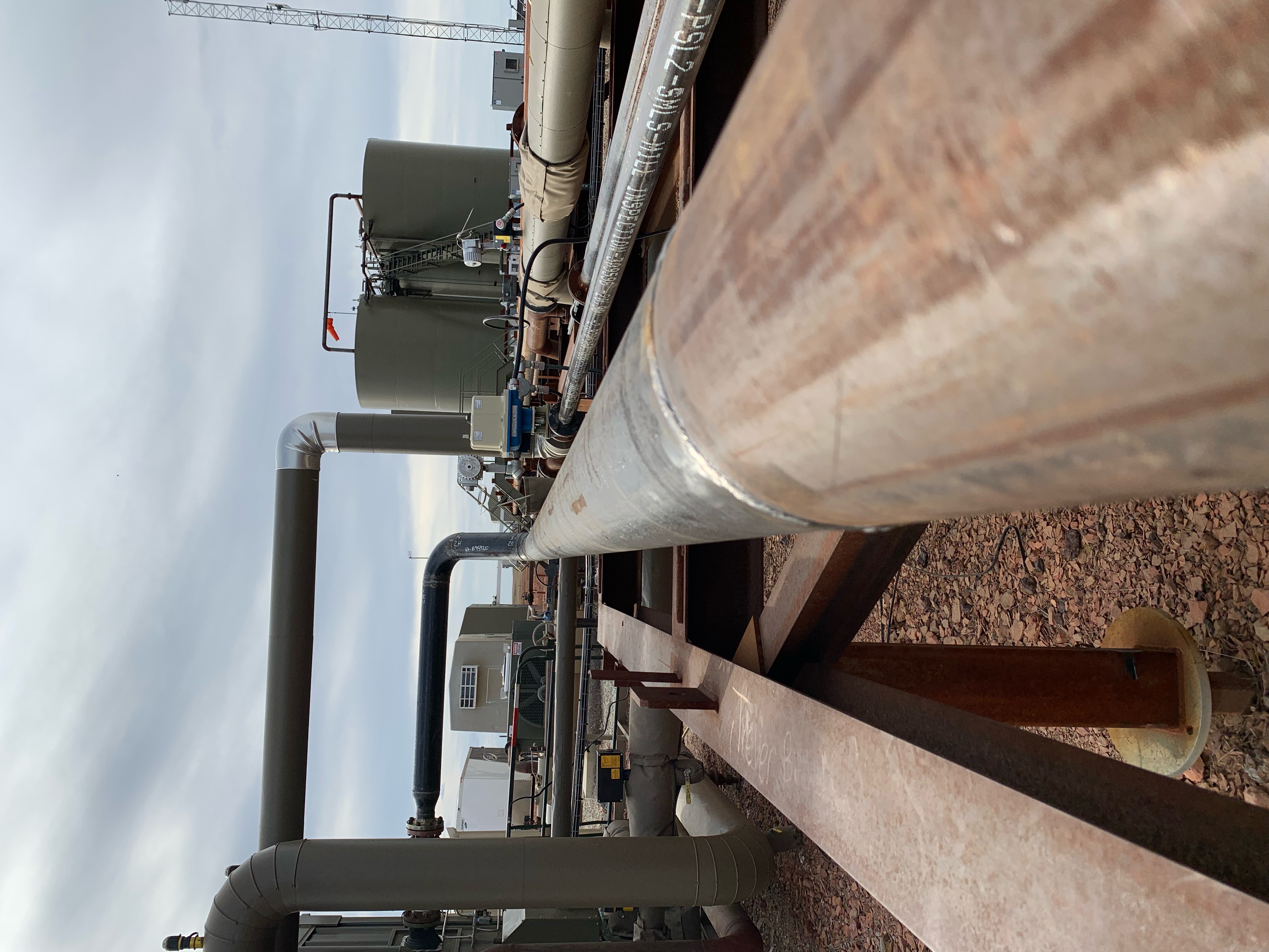 Process piping and equipment across a developed energy facility.